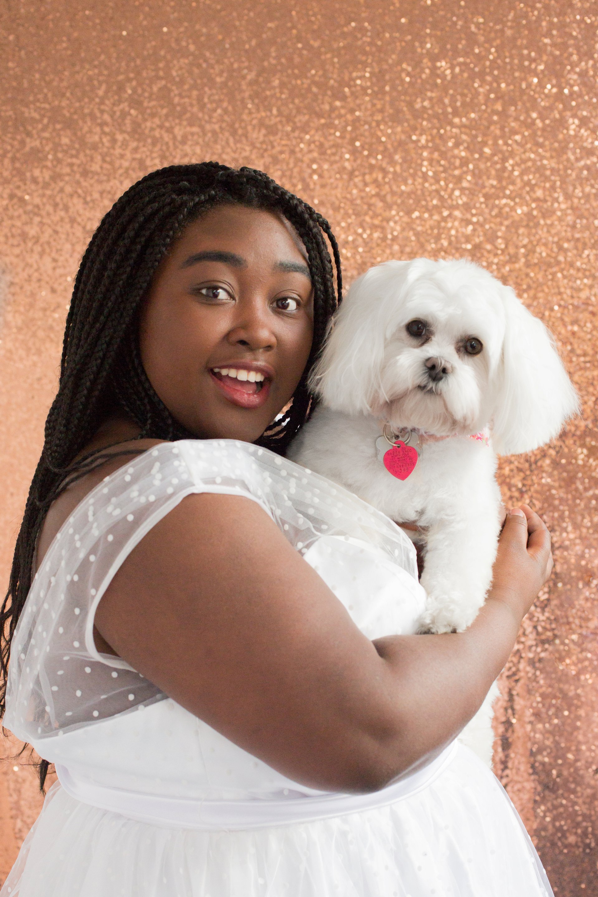 Adorable senior portrait of teenager with pet dog. African American beauty, senior portrait, Fairbanks, Alaska.